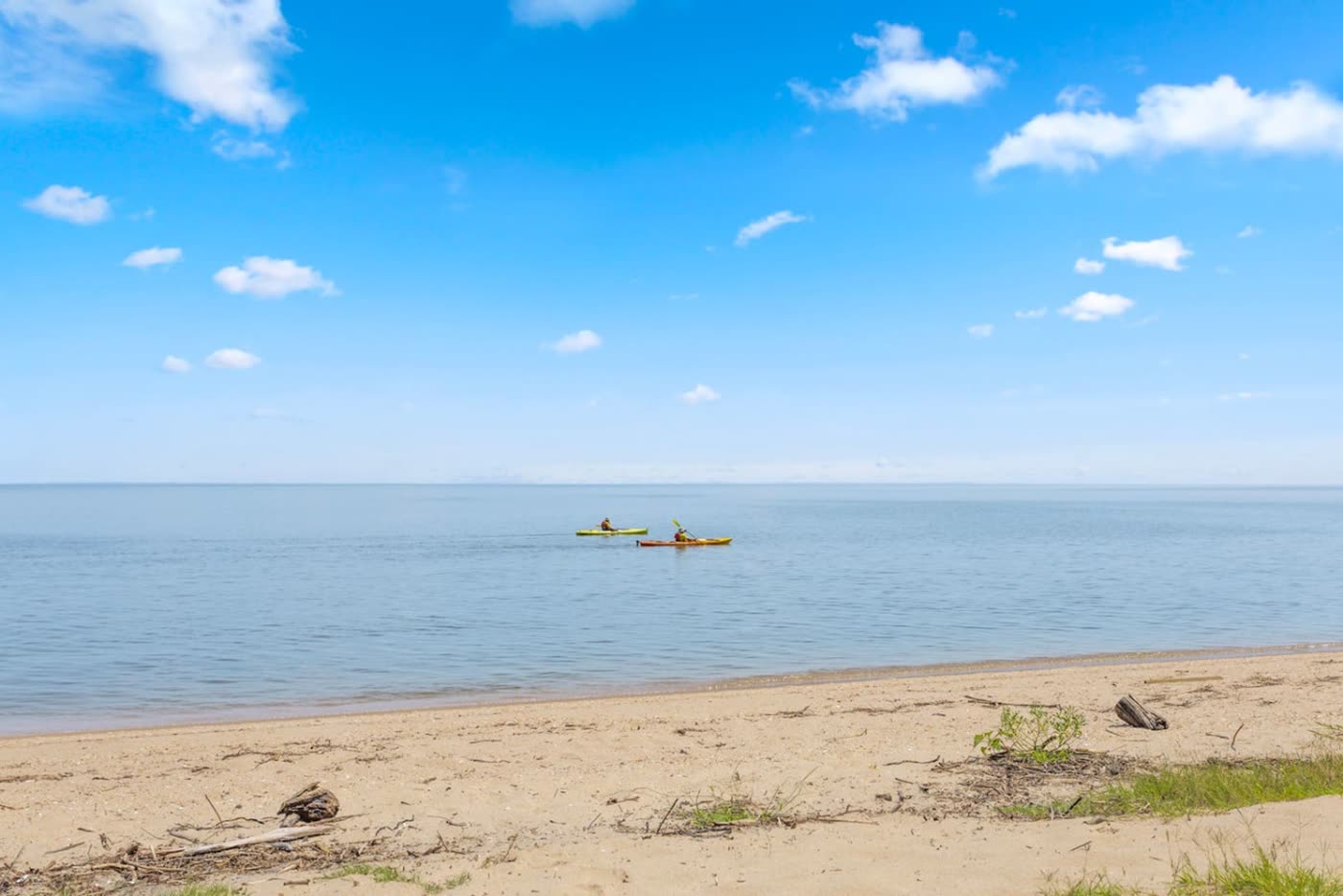 Two kayakers on the calm Chesapeake Bay off Plum Point, Maryland